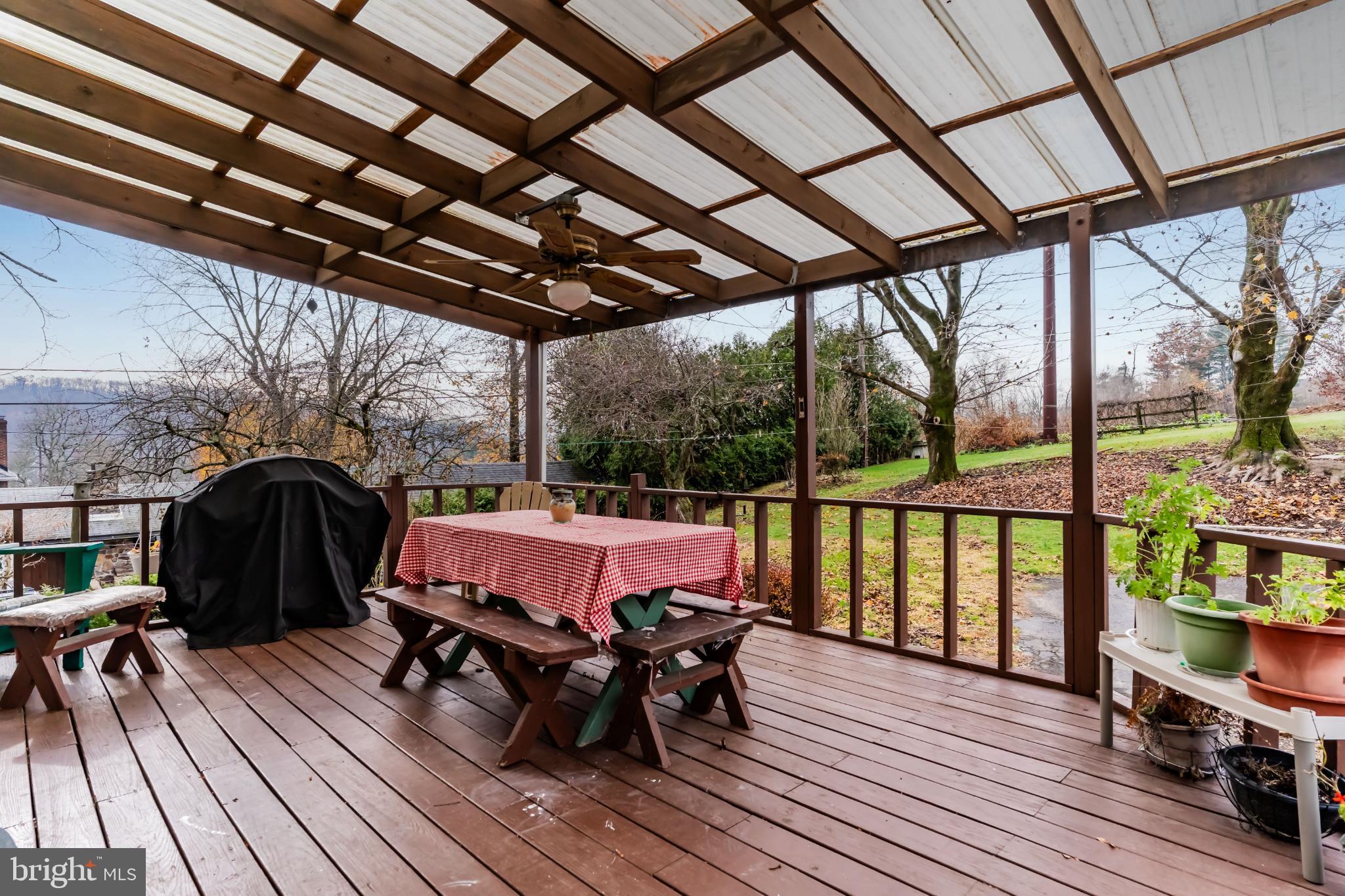 21 Hallton Hill Road Pine Grove, PA 17963 - Photo 4 of 22 a view of a deck with wooden floor and outdoor seating