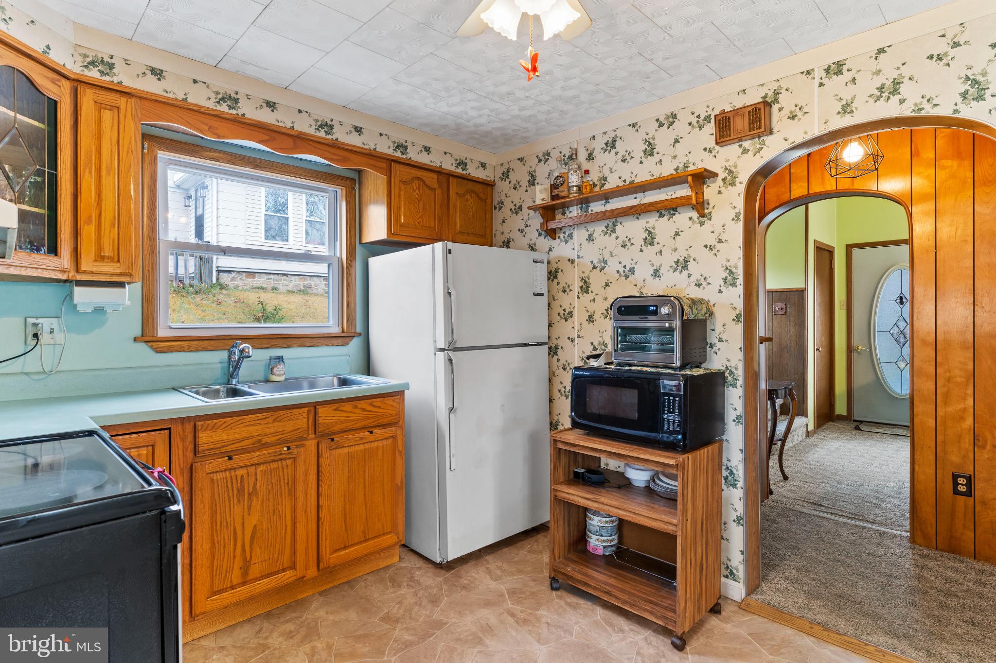 21 Hallton Hill Road Pine Grove, PA 17963 - Photo 6 of 22 a utility room with stainless steel appliances granite countertop a refrigerator and a stove