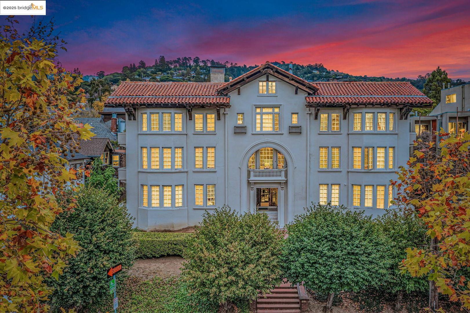 a front view of a residential apartment building with a yard