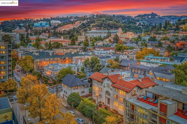 a front view of a residential apartment building with a yard