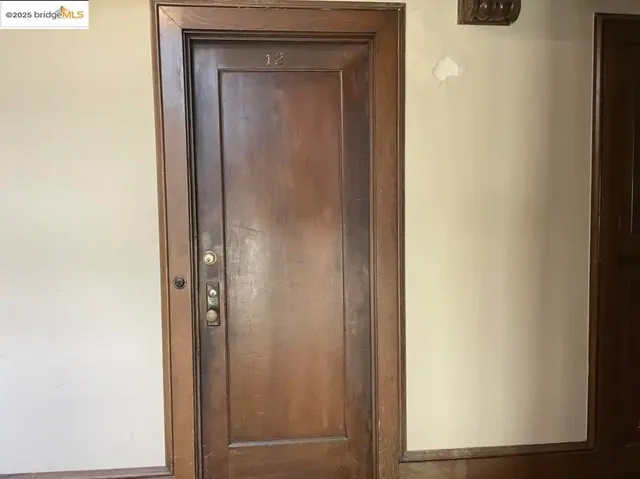 a white toilet sitting next to a white sink