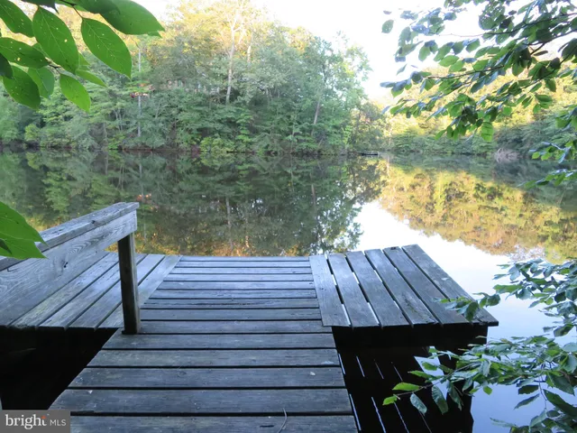 a view of a wooden deck with a bench