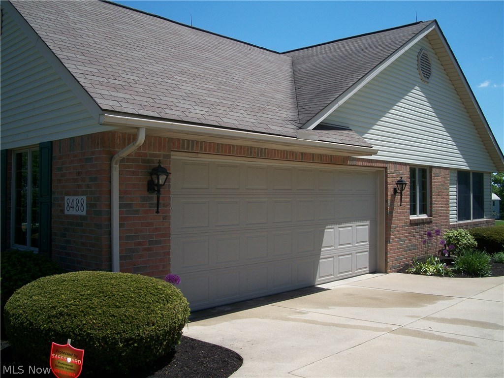 8488 Massillon Road Navarre, OH 44662 - Photo 24 of 25 18' garage door, hot and cold water, electric, and drain in garage.