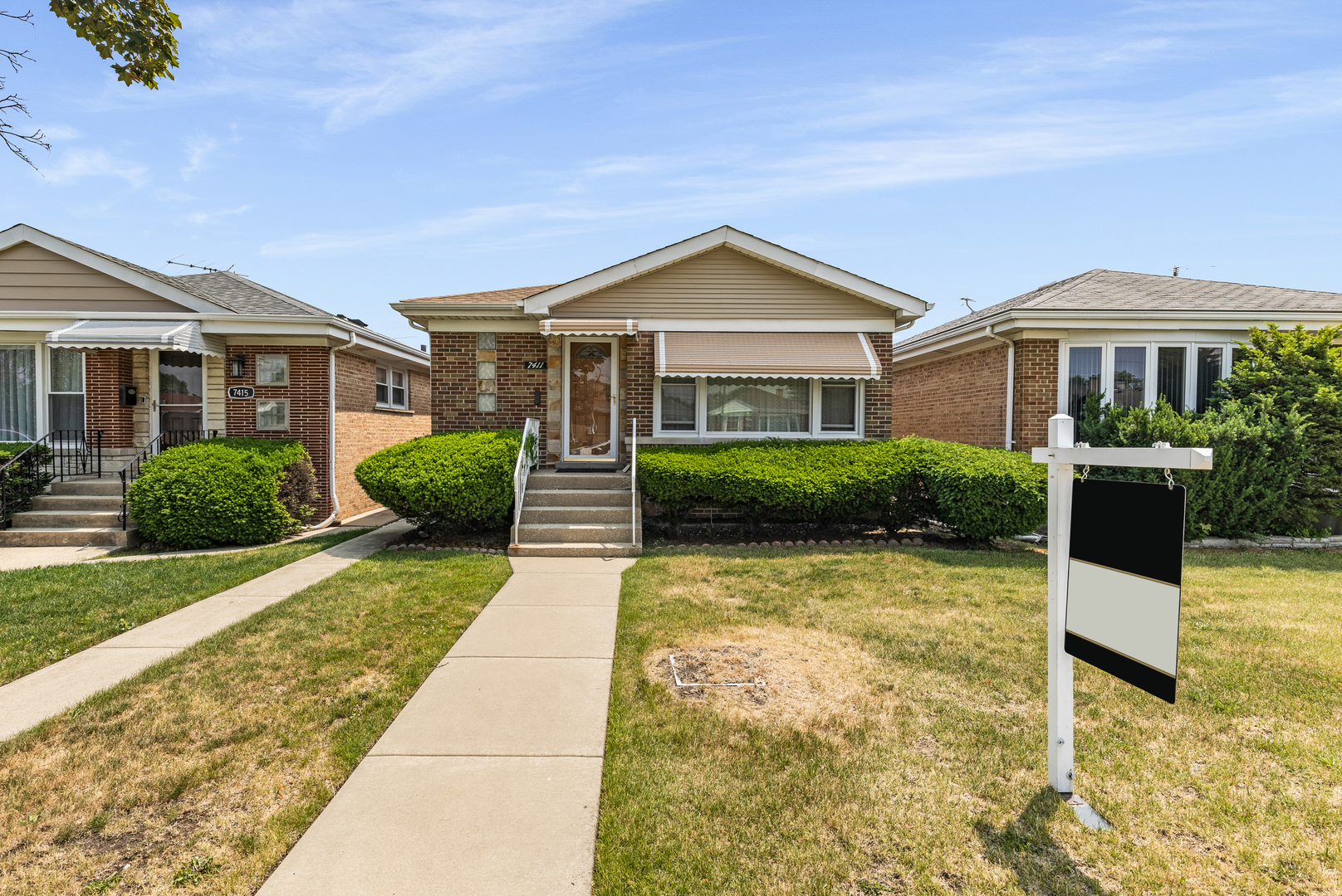 7411 North Oconto Avenue Chicago, IL 60631 - Photo 1 of 19 a view of a house with a yard
