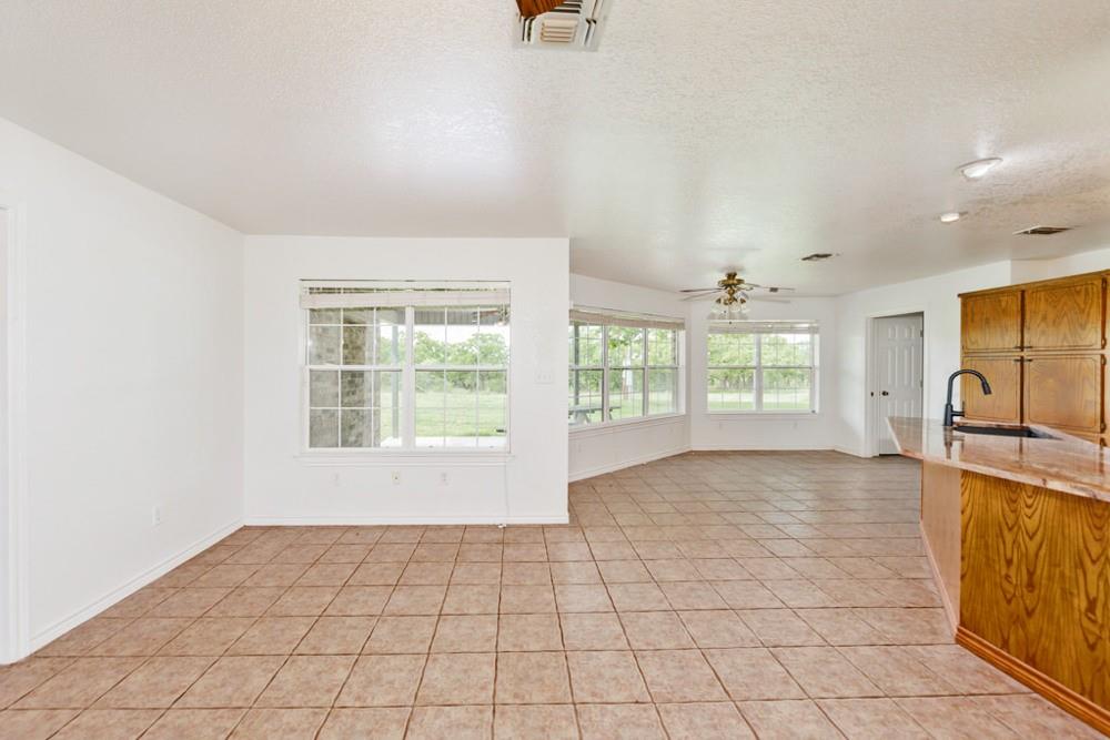 4316 Leona Road Bowie, TX 76230 - Photo 12 of 37 a view of an empty room with a window