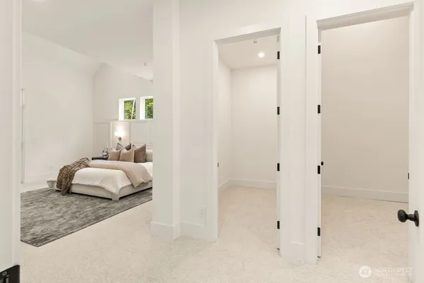 a spacious bedroom with a bed and a couch
