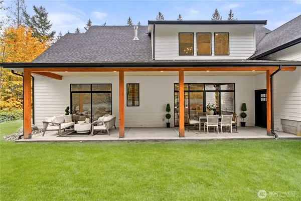 a view of a house with a yard porch and sitting area