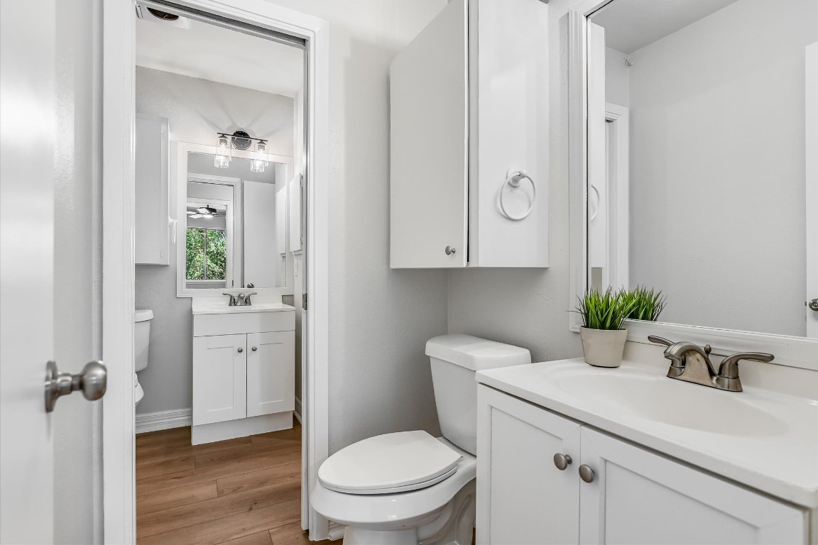 736 Wales Way Austin, TX 78748 - Photo 14 of 25 a bathroom with a sink a toilet and a mirror