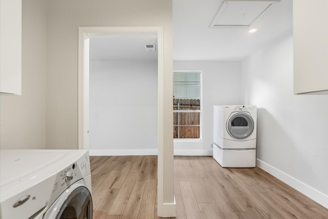 736 Wales Way Austin, TX 78748 - Photo 8 of 25 a view of a storage & utility room with washer and dryer
