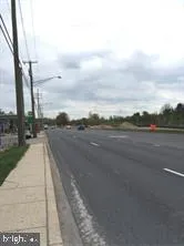 a view of a city street with a building in the background