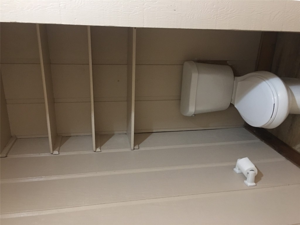 5251 Hwy 290 W Dripping Springs West, Unit 1 Dripping Springs, TX 78620 - Photo 2 of 15 a white toilet sitting next to a small window