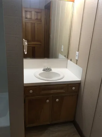 a bathroom with a sink and a mirror