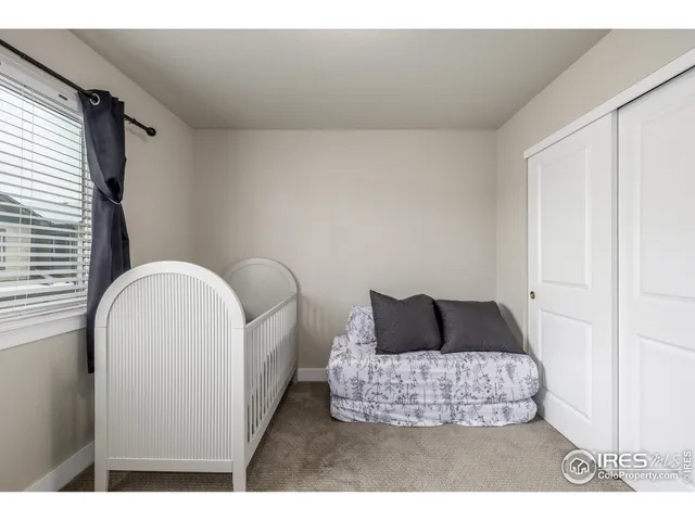 a living room with a couch and a window
