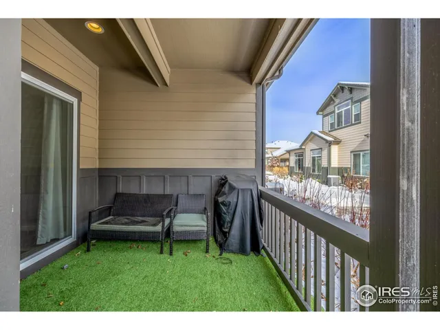 a view of two chairs in the balcony