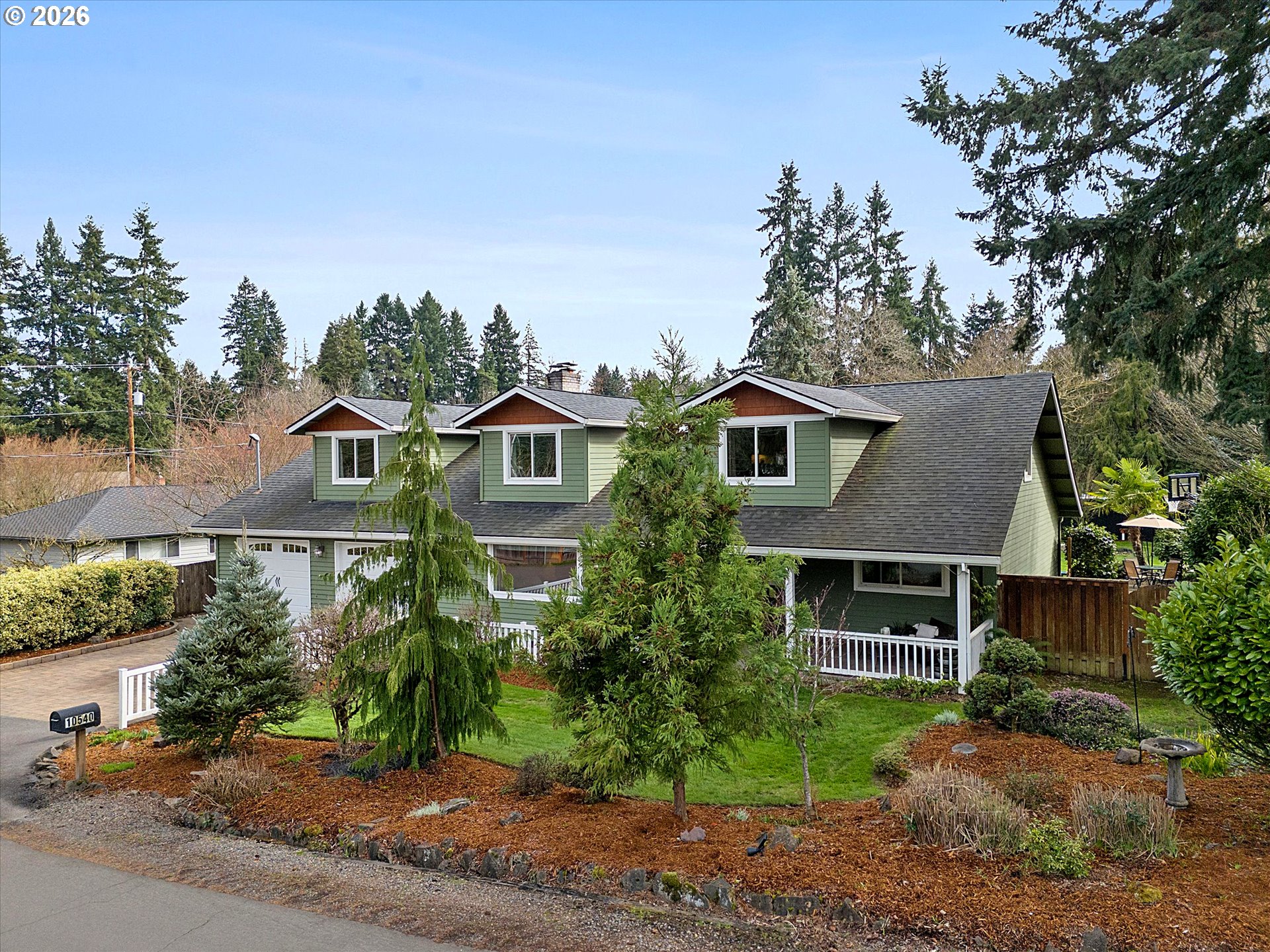 10540 Southwest Errol Street Tigard, OR 97223 - Photo 1 of 47 a front view of a house with a yard and garage