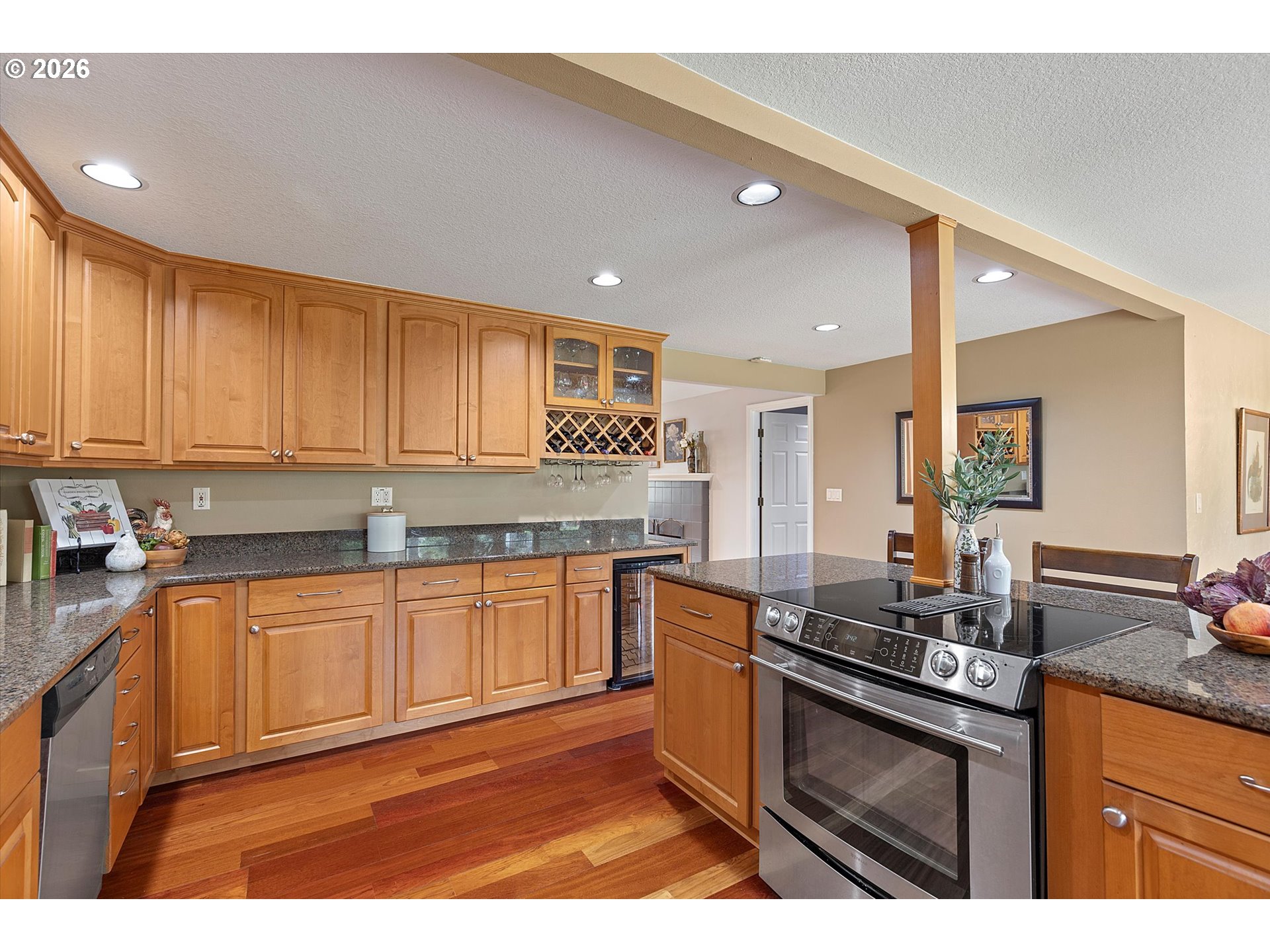 10540 Southwest Errol Street Tigard, OR 97223 - Photo 11 of 47 a kitchen with stainless steel appliances granite countertop a sink stove and cabinets