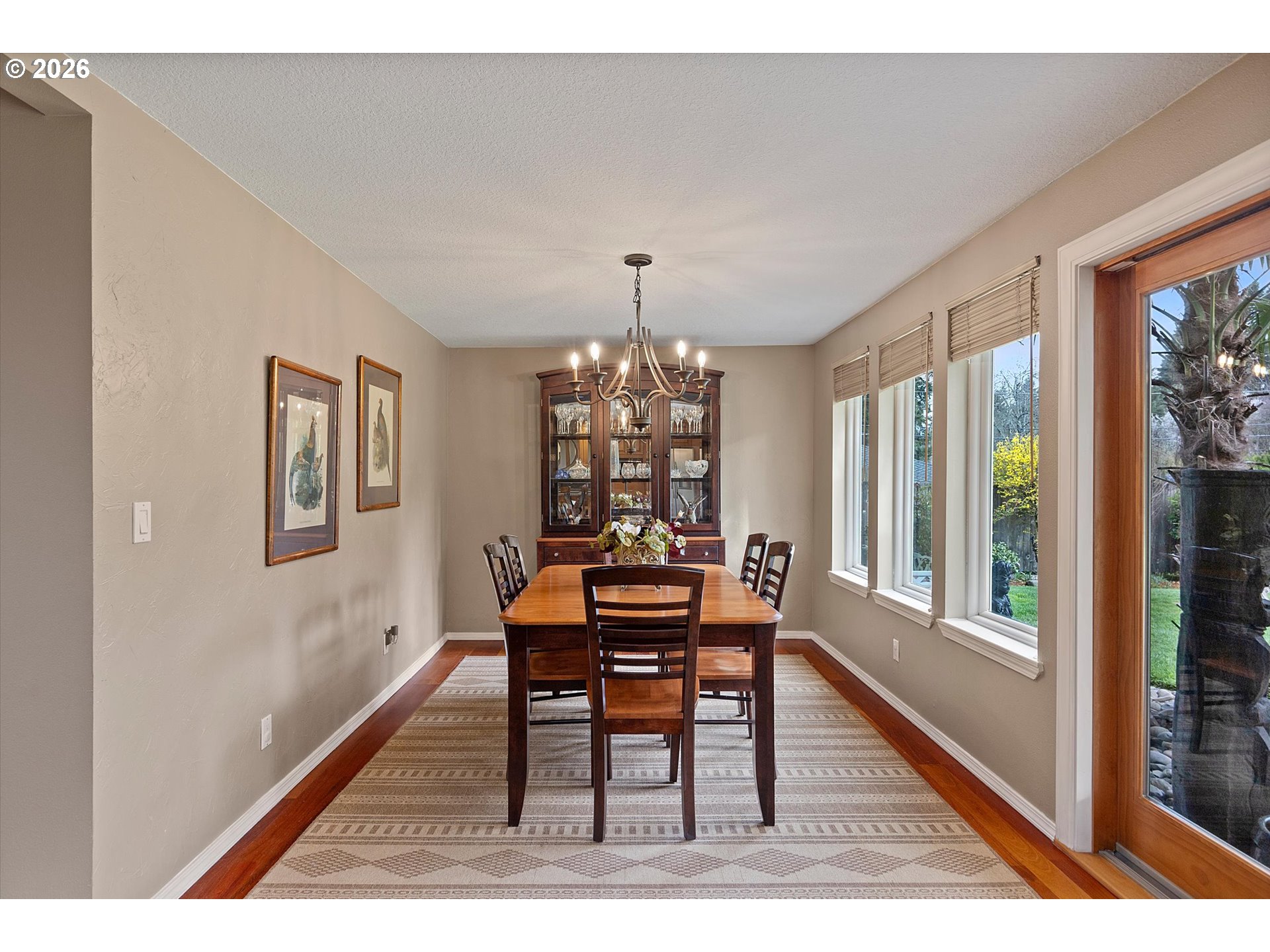 10540 Southwest Errol Street Tigard, OR 97223 - Photo 13 of 47 a dining room with furniture a rug and a chandelier