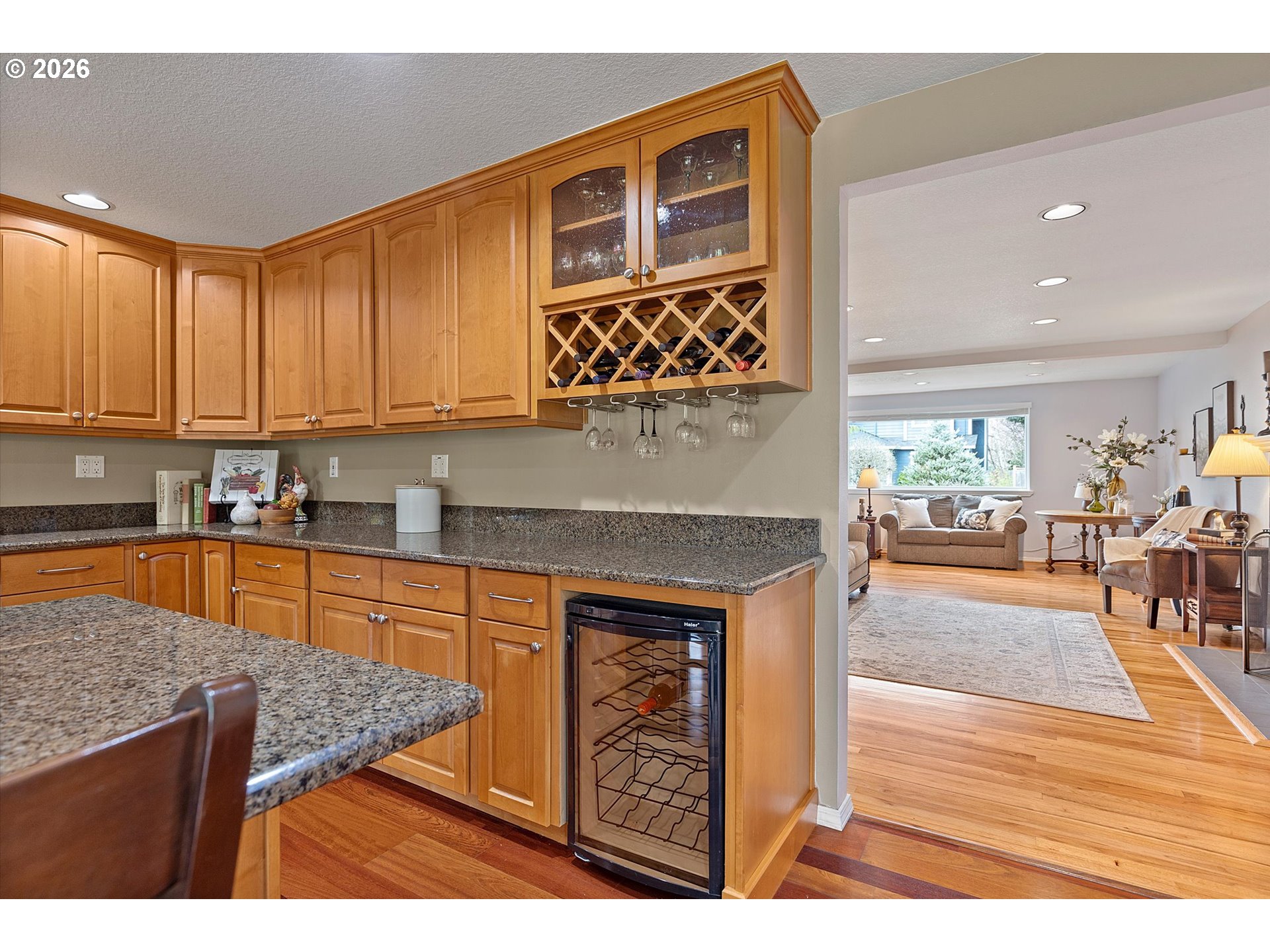 10540 Southwest Errol Street Tigard, OR 97223 - Photo 14 of 47 a kitchen with stainless steel appliances granite countertop a stove a sink and a microwave