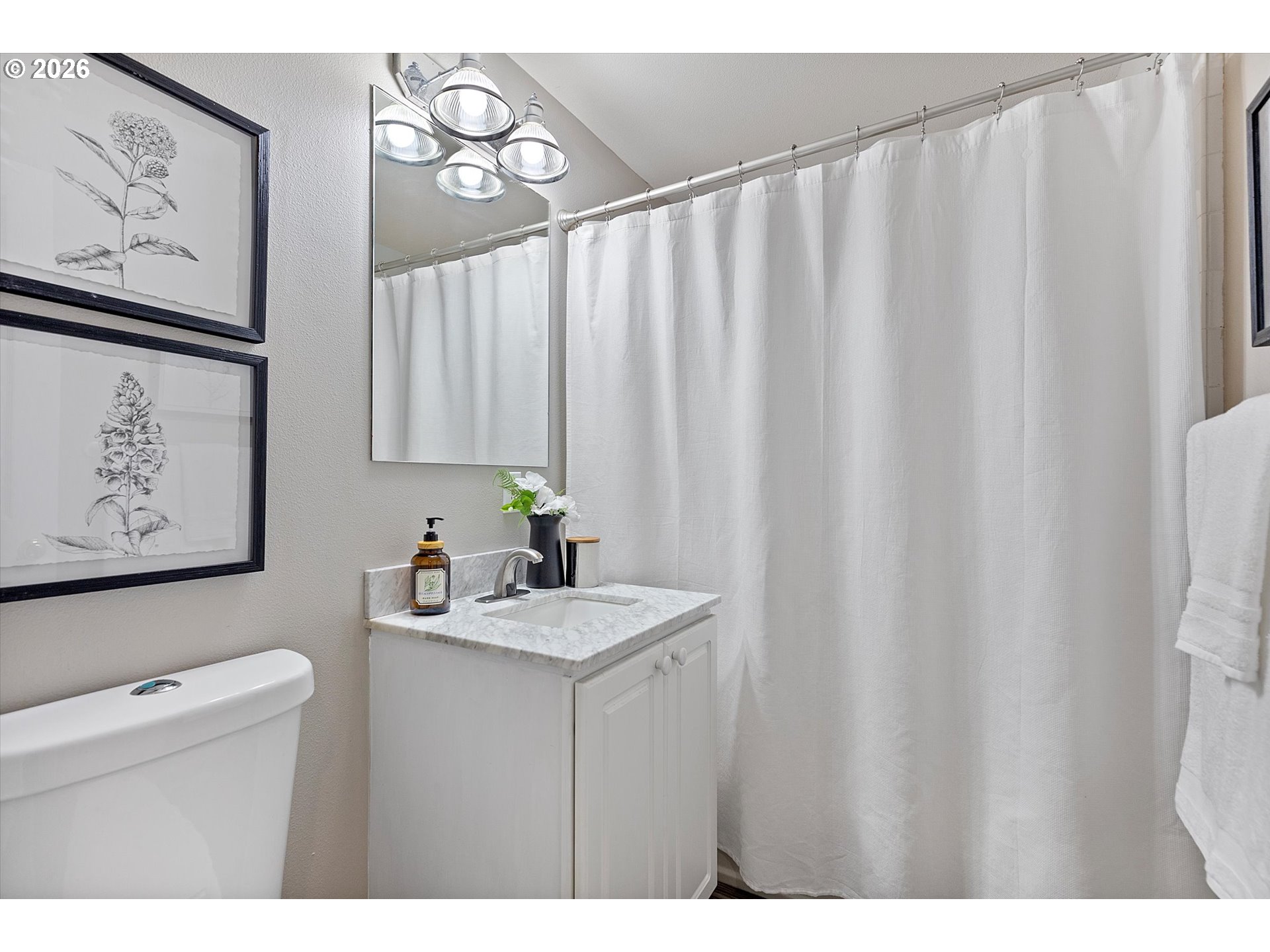10540 Southwest Errol Street Tigard, OR 97223 - Photo 15 of 47 a bathroom with a sink and a mirror