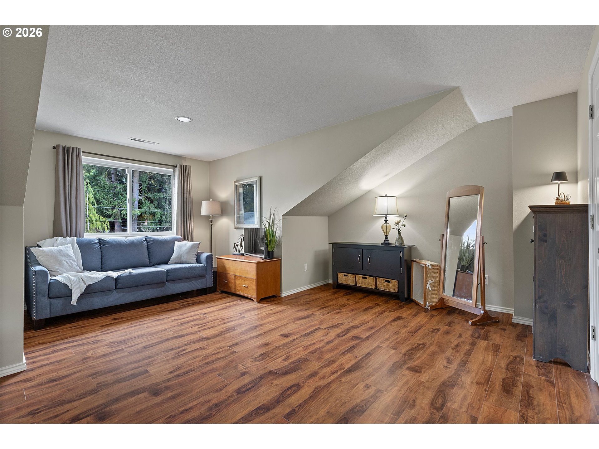 10540 Southwest Errol Street Tigard, OR 97223 - Photo 22 of 47 a living room with furniture and a wooden floor