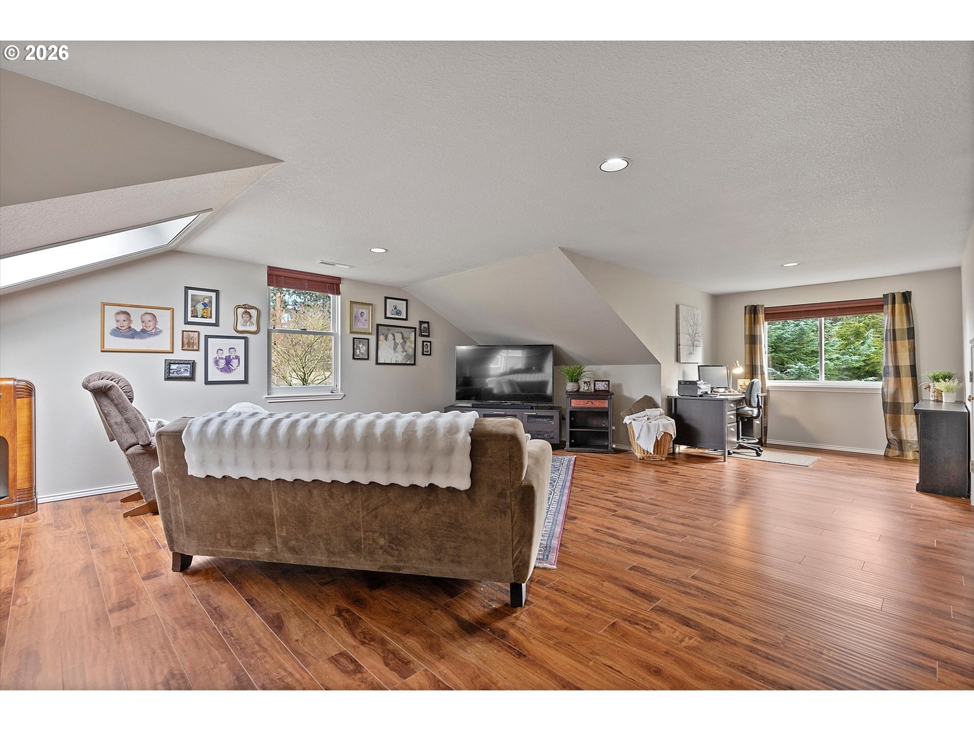 10540 Southwest Errol Street Tigard, OR 97223 - Photo 28 of 47 a living room with furniture and a wooden floor