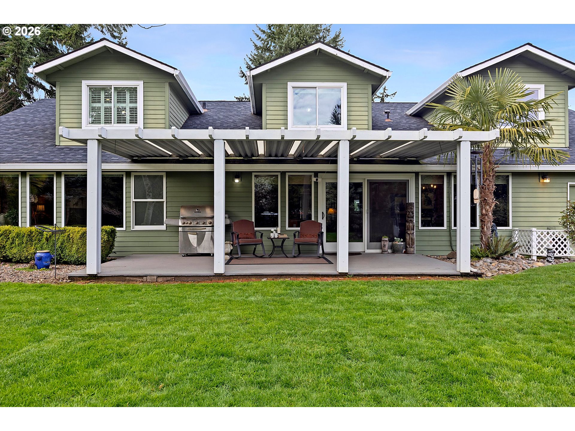 10540 Southwest Errol Street Tigard, OR 97223 - Photo 40 of 47 a front view of a house with a yard garden and patio