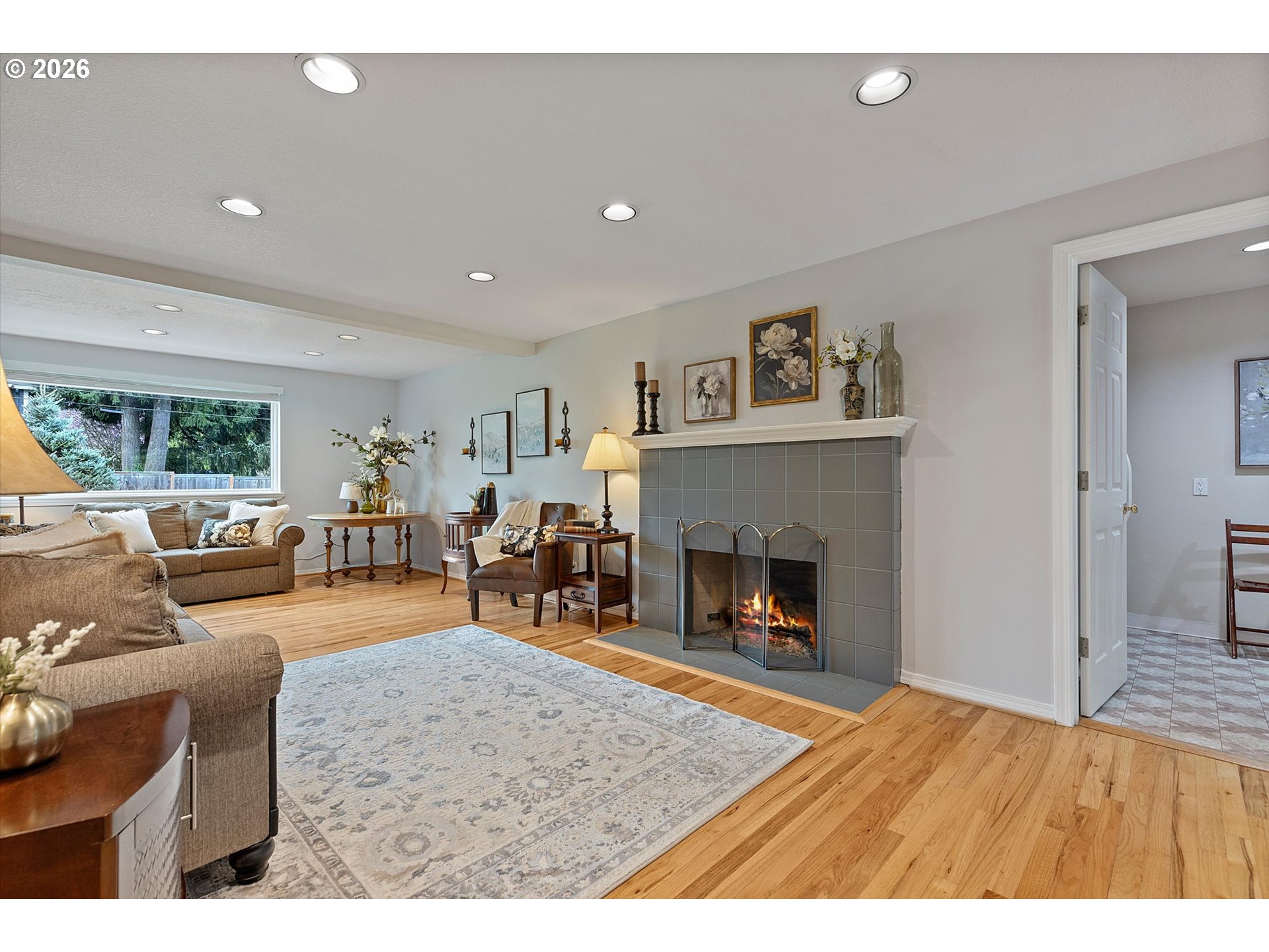 10540 Southwest Errol Street Tigard, OR 97223 - Photo 6 of 47 a living room with furniture and a fireplace