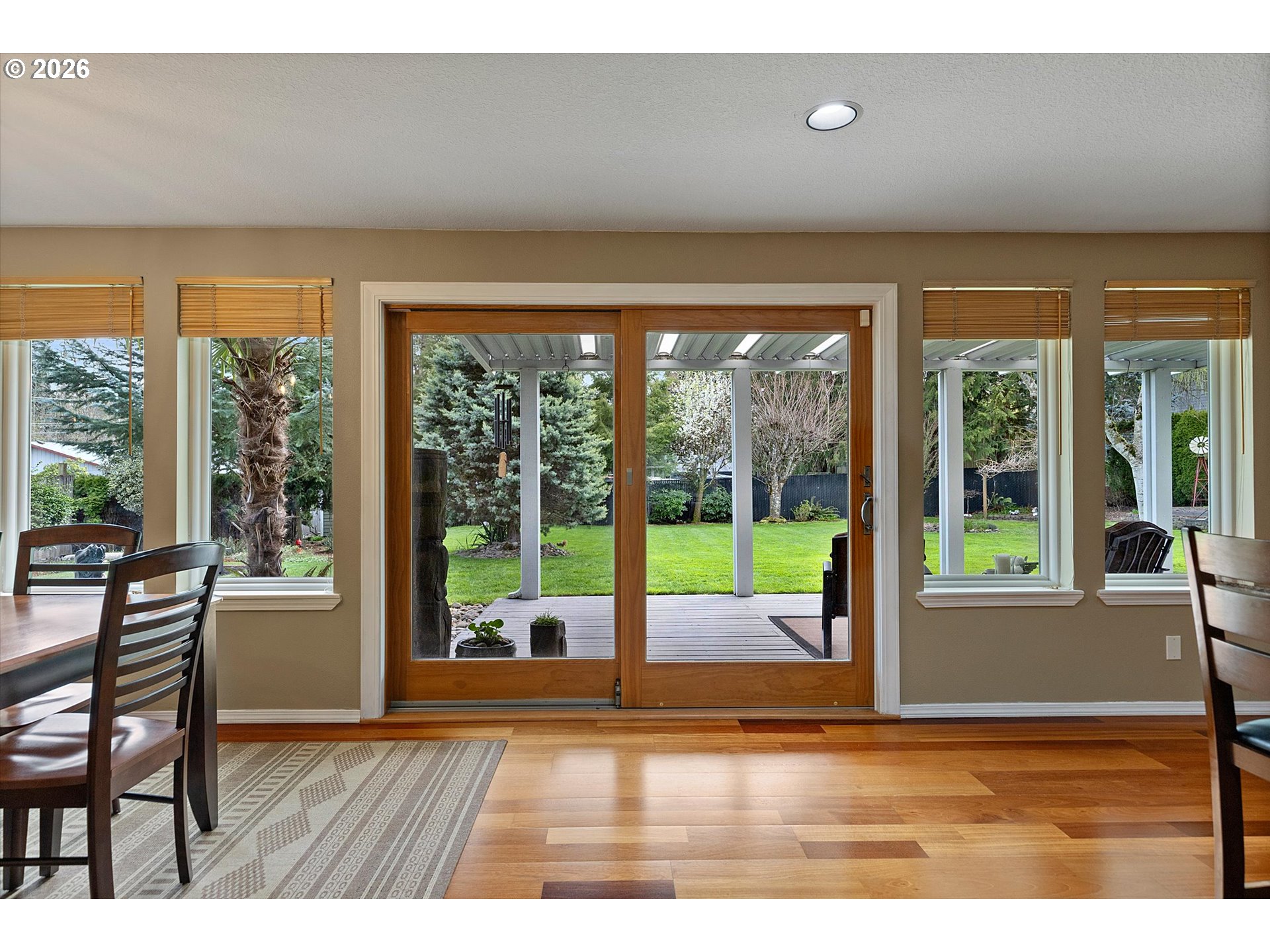 10540 Southwest Errol Street Tigard, OR 97223 - Photo 9 of 47 a view of an empty room with wooden floor and windows