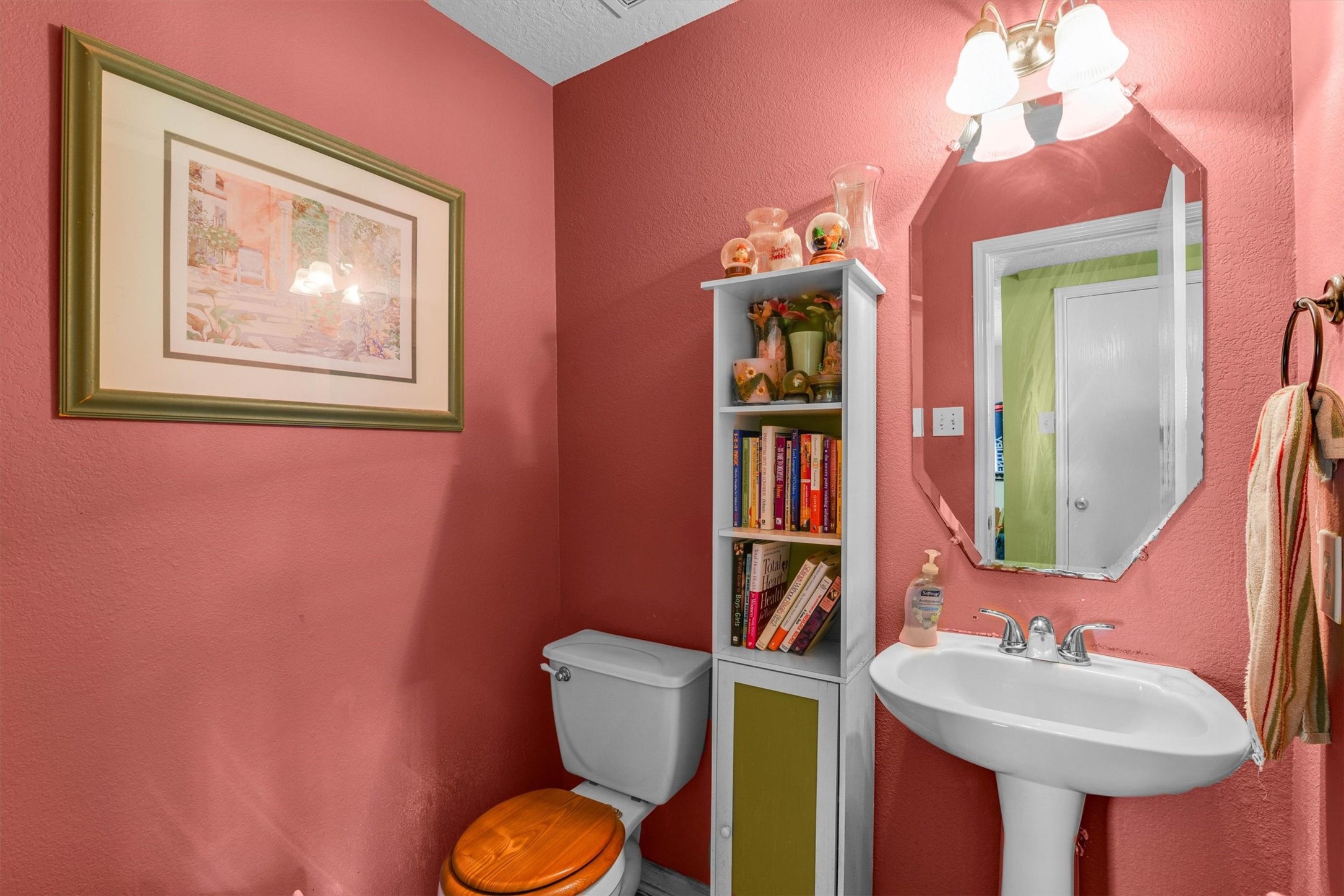 3003 Legends York Drive Spring, TX 77386 - Photo 15 of 29 a bathroom with a toilet sink and mirror
