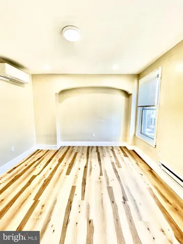 a bed room with a bed and a night stand