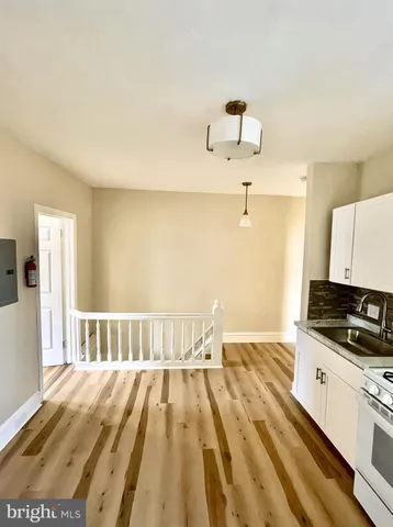 a view of bedroom with wooden floor