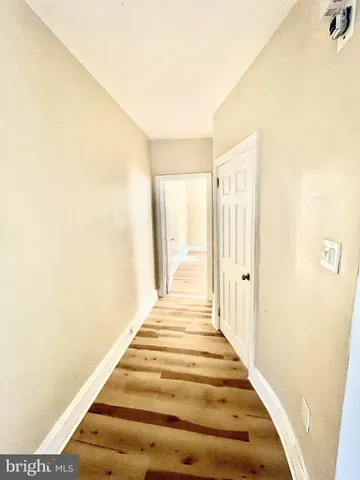 a view of bedroom with wooden floor