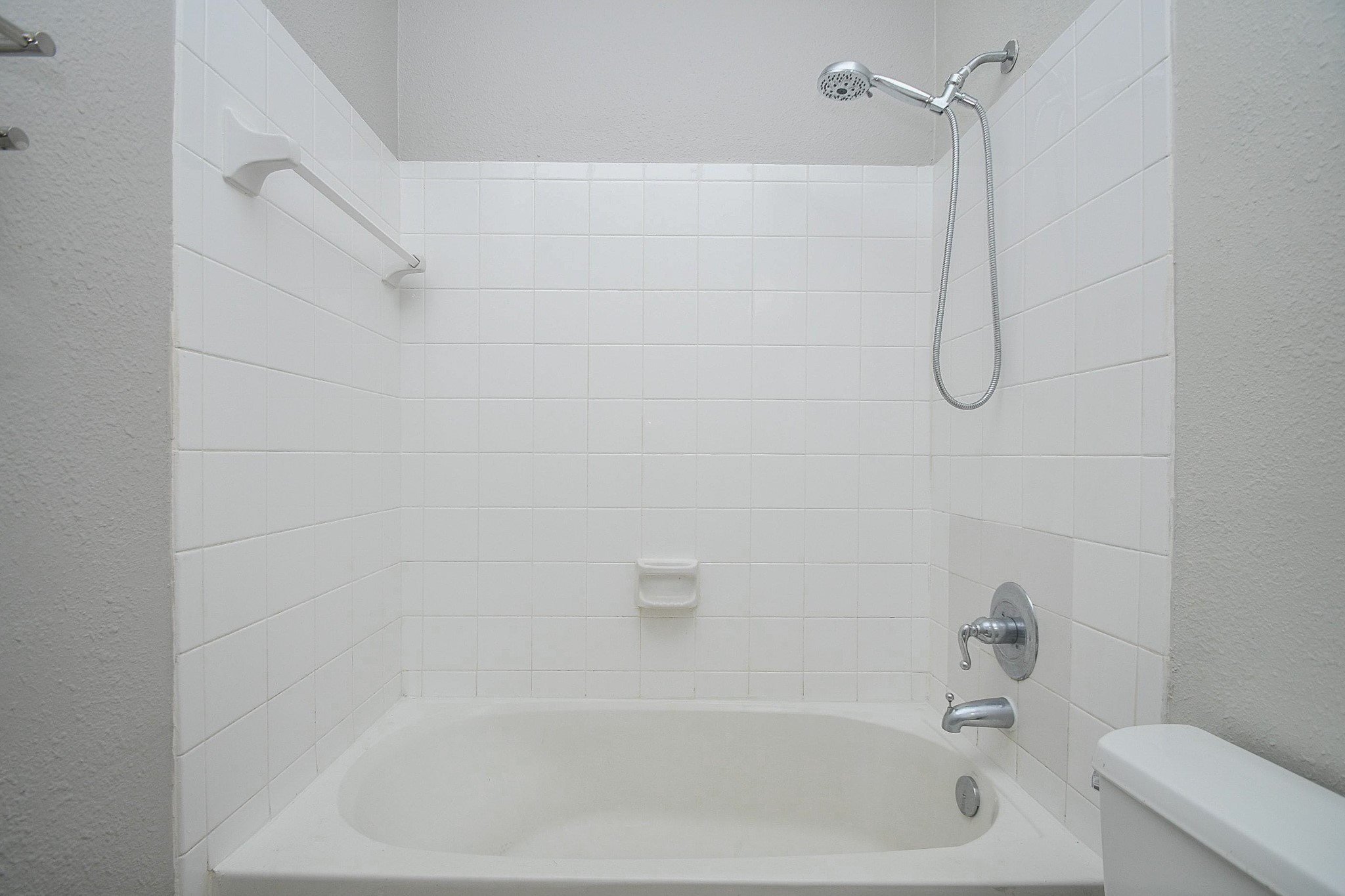 5602 Walkabout Way Katy, TX 77450 - Photo 29 of 33 a bathroom with a bath tub with a shower