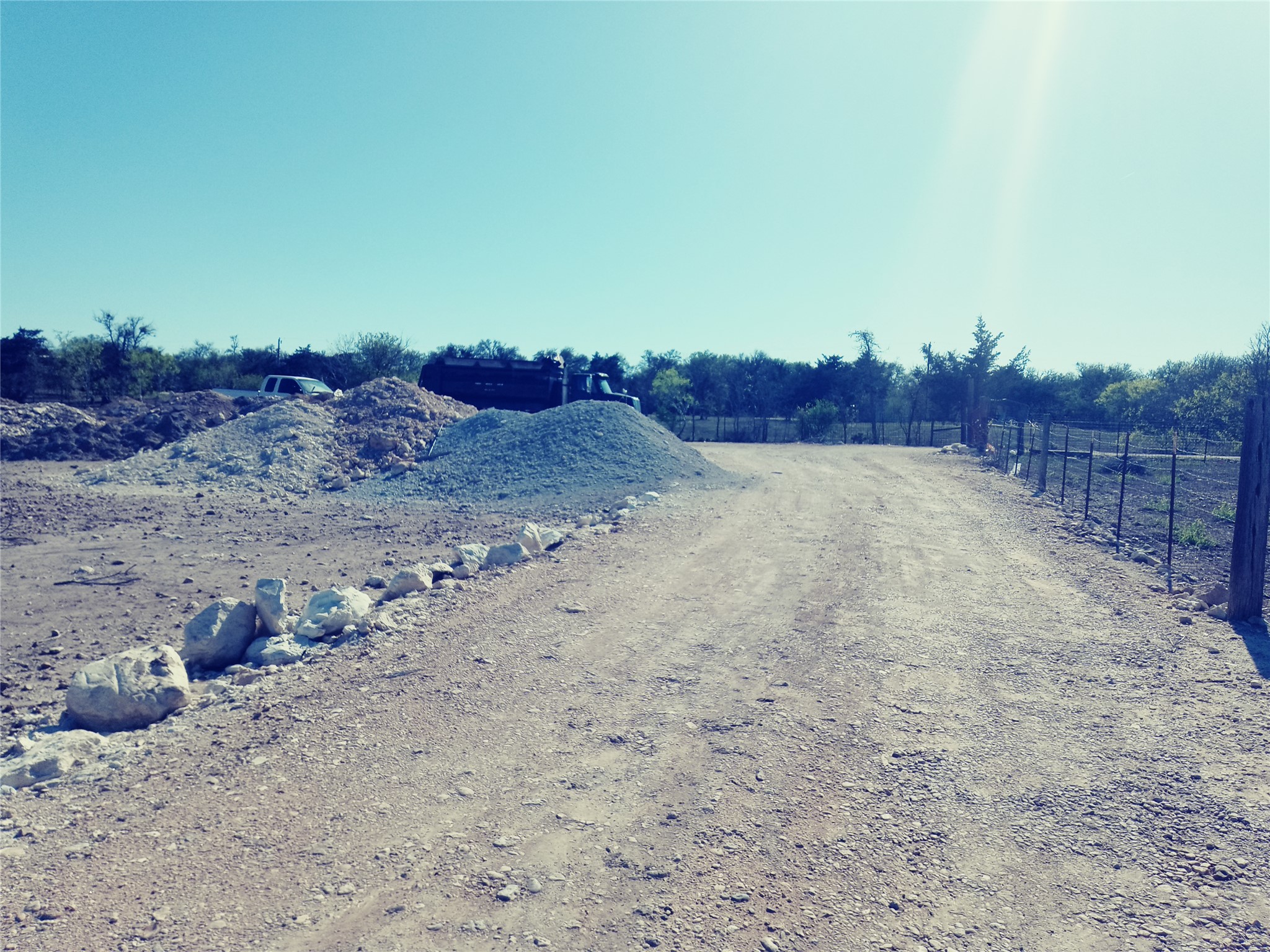 11717 Schriber Road, Unit B Buda, TX 78610 - Photo 5 of 7 a view of a dry yard with wooden fence