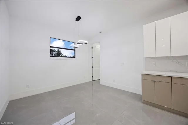 an empty room with a fireplace