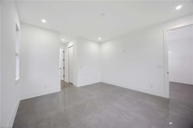 a kitchen with sink and refrigerator