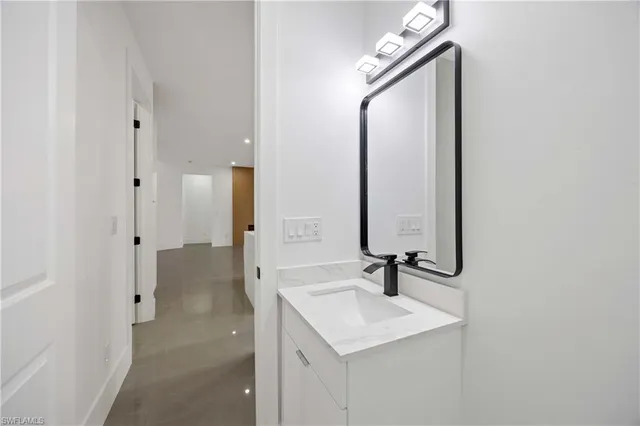 a bathroom with a sink a mirror and a shower