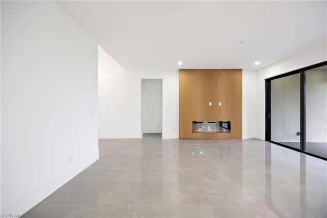 a view of an empty room with a sliding door