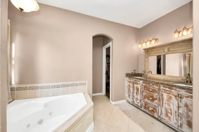 a view of a hallway with wooden floor and stairs