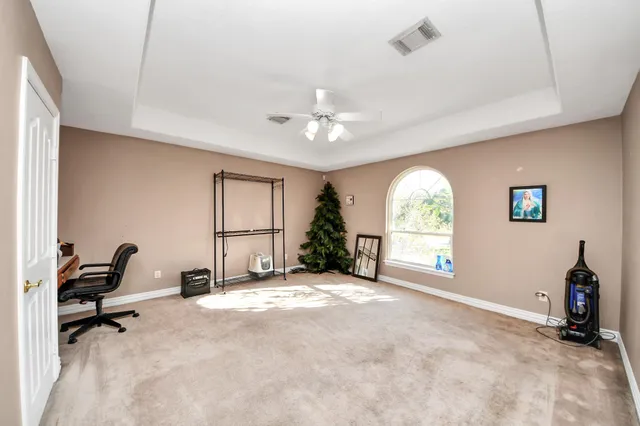 a en suite bathroom with a double vanity sink a mirror and a bathtub