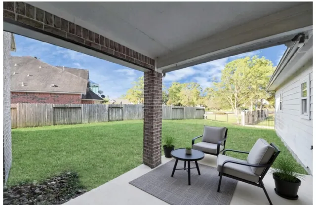a view of a house with a back yard