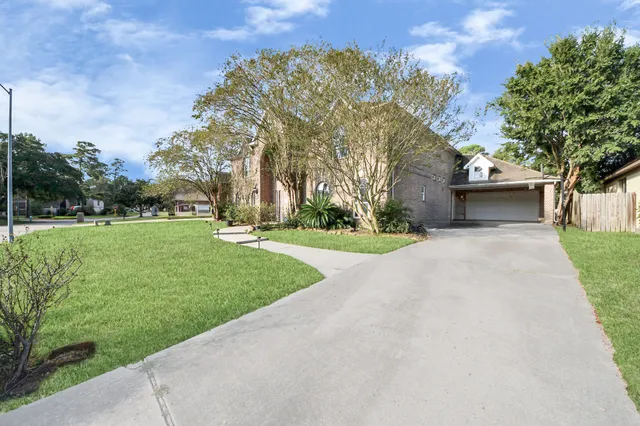 an aerial view of a house with a garden