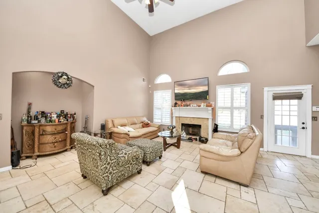 a living room with furniture fireplace and a fireplace