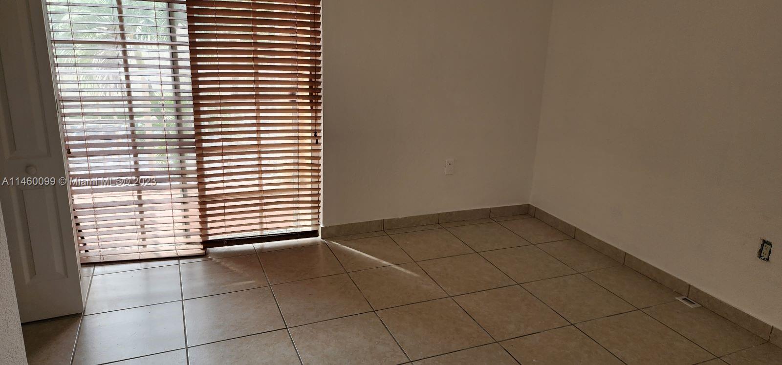 501 West 68th Street, Unit 4 Hialeah, FL 33014 - Photo 12 of 20 a view of an empty room with a window