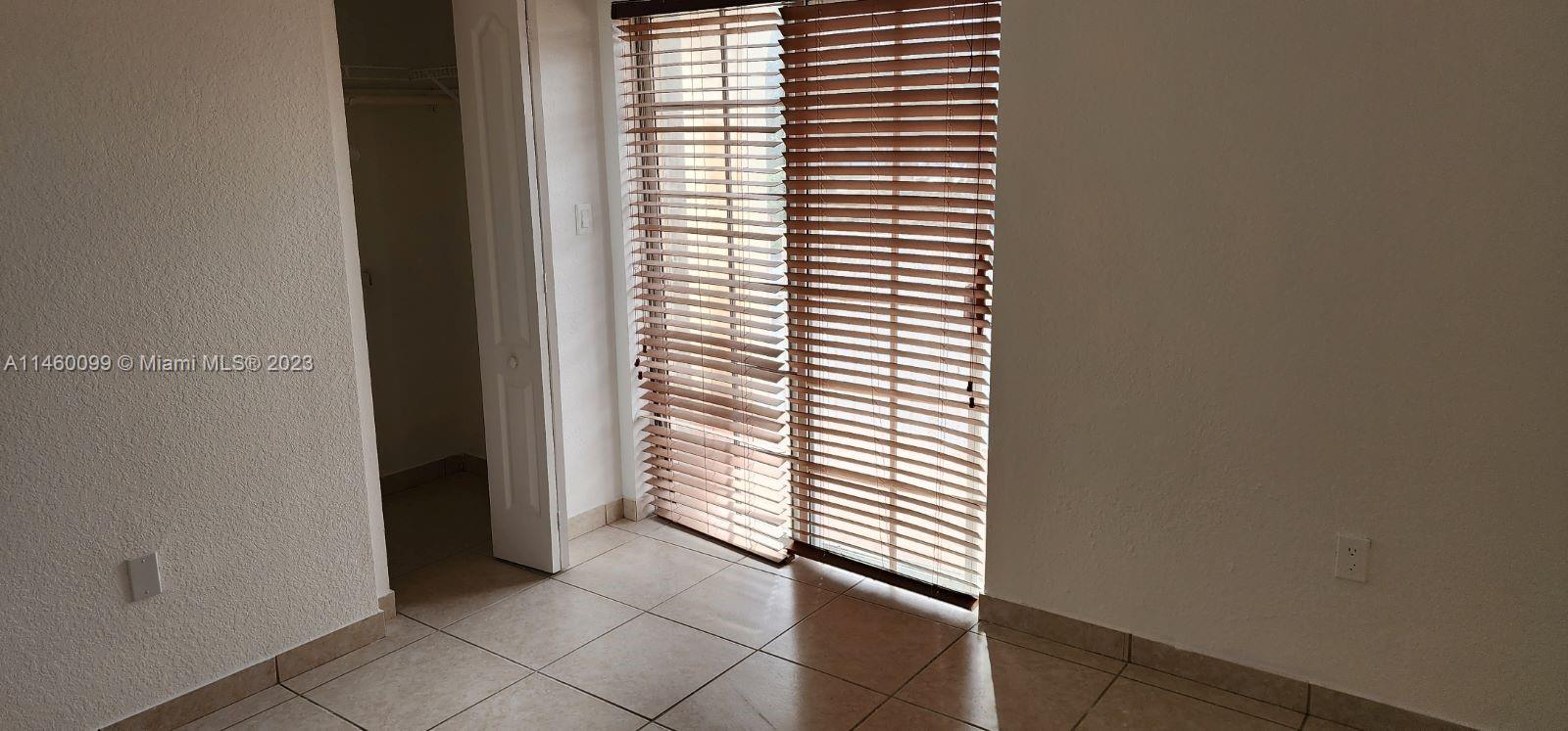 501 West 68th Street, Unit 4 Hialeah, FL 33014 - Photo 13 of 20 a view of a bedroom with a window
