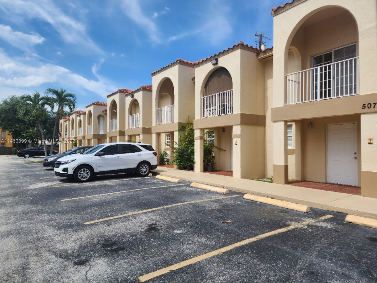 501 West 68th Street, Unit 4 Hialeah, FL 33014 - Photo 19 of 20 a front view of a house with a yard
