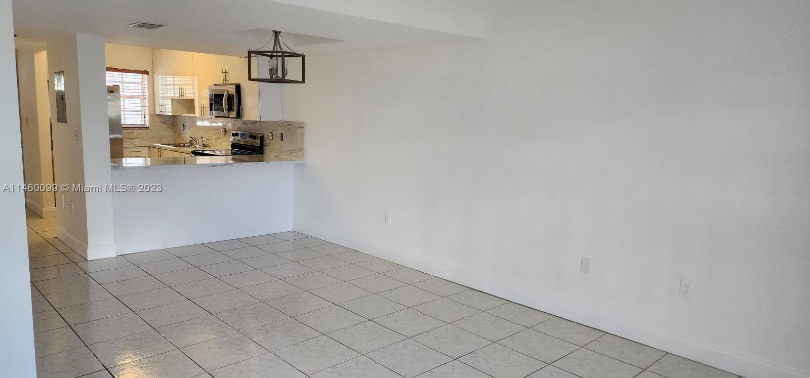 501 West 68th Street, Unit 4 Hialeah, FL 33014 - Photo 9 of 20 a view of kitchen and windows
