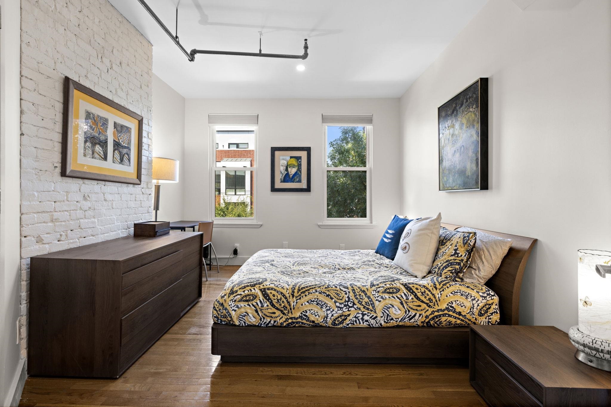 309 Monroe Street, Unit FIVE Hoboken, NJ 07030 - Photo 4 of 14 a bedroom with a bed and dresser