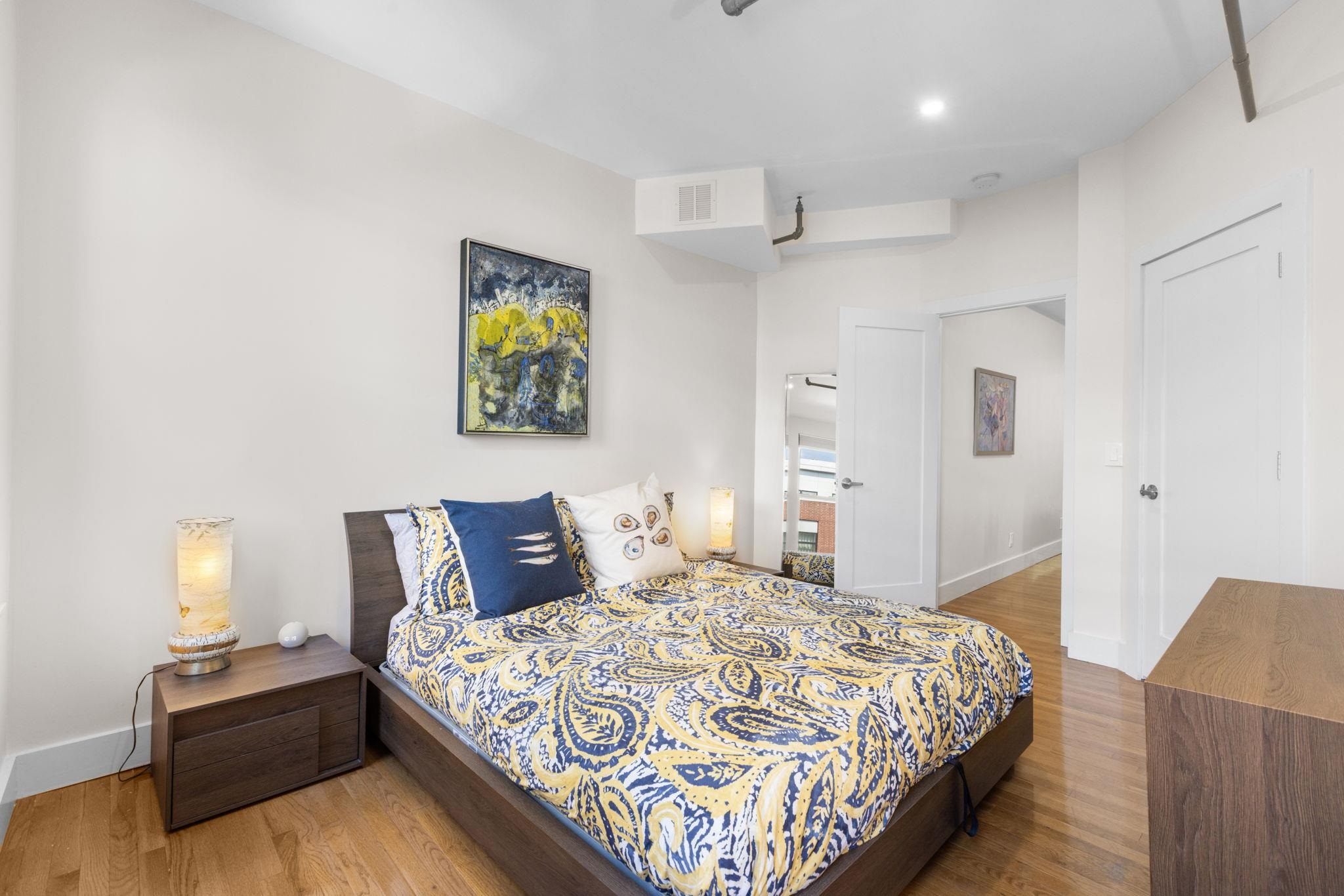 309 Monroe Street, Unit FIVE Hoboken, NJ 07030 - Photo 6 of 14 a bedroom with a bed and cupboard