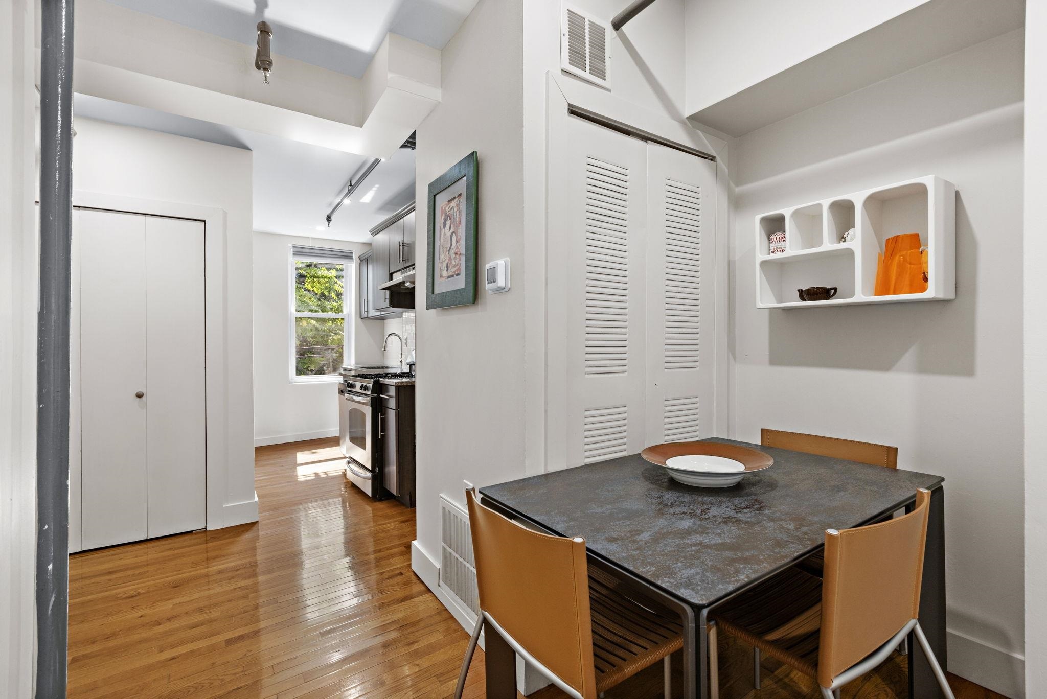 309 Monroe Street, Unit FIVE Hoboken, NJ 07030 - Photo 7 of 14 a view of a dining room with furniture and wooden floor